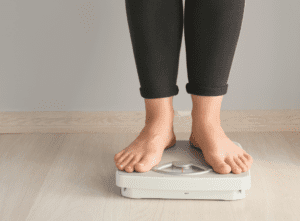 Woman stood on bathroom scales