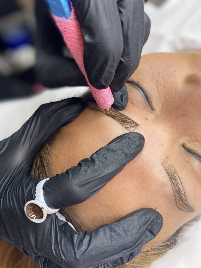 Beauty specialist performing microblading at Omniya Clinic London